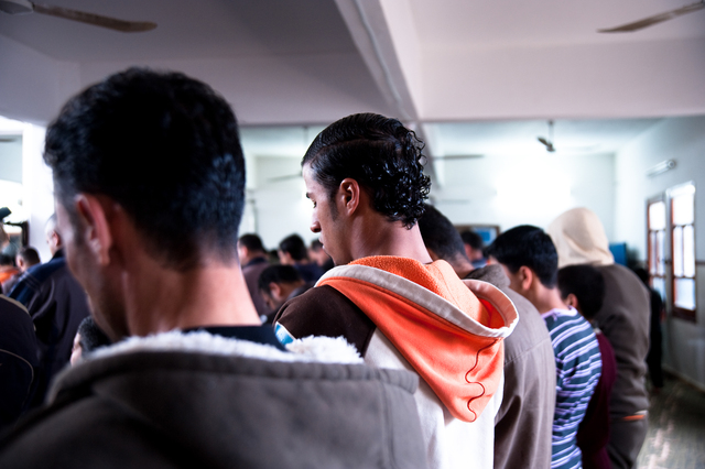 Gaza, Mahmoud Osama Al-Rayashi praying with friends in his neighbourhood mosque