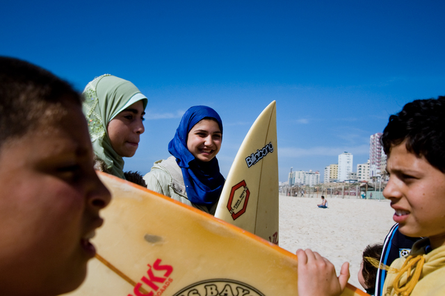 Gaza City, young surfers Shorouq Abu Ghanem, 14, and Rwan Abu Ghanem, 14 (left, cousin of Shorouq) at the beach before surfing.