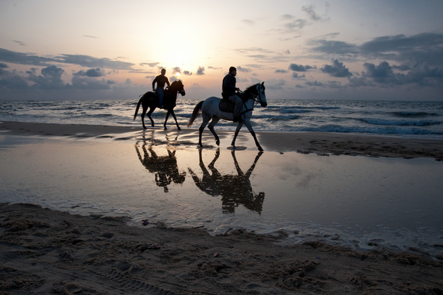 Gaza, men on horseback along the beach