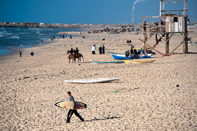 Gaza, a surfer on the city's southern beach