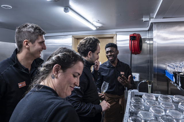 Reykholt (Iceland): Julio Moukoufou, a 28-year-old Italian-Ghanaian waiter (on the right), chats with some colleagues in the kitchen at Friðheimar. Julio arrived in Iceland four years ago to work during the summer season with his girlfriend at the time (with whom he is no longer together), and he has never left.