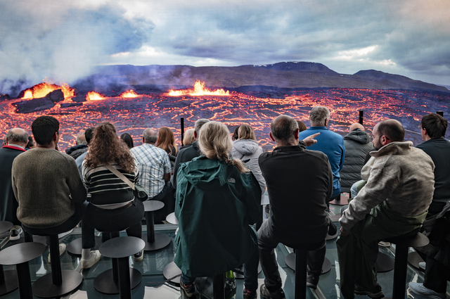 Reykjavik (Iceland): at the Perlan Museum, a group of tourists are watching a visual display on a giant screen dedicated to volcanic activity in Iceland. Perlan is an interactive natural history museum that showcases Iceland’s geological wonders and phenomena.