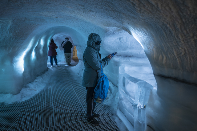 Reykjavik (Iceland): at the Perlan museum, some tourists are exploring the 100-metre-long artificial ice tunnel, built using tonnes of real snow and ice. Perlan is an interactive natural history museum that showcases Iceland’s wonders and geological phenomena.